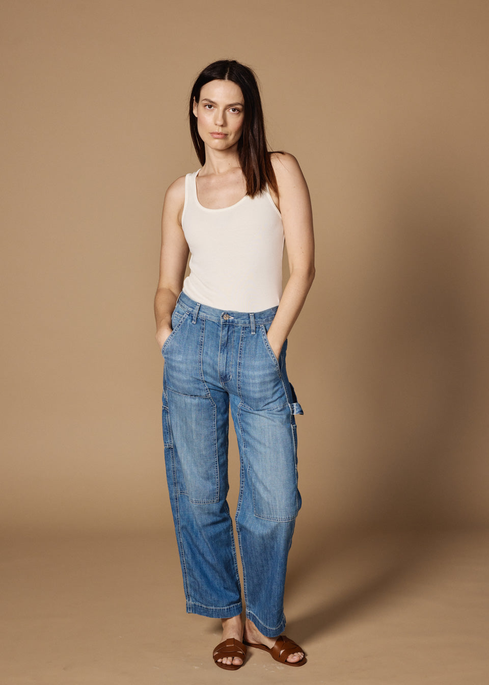 The BAILEE is a relaxed women's utility pant with a patch-front detail. The high-rise pant sits at the natural waist with a relaxed leg. In a light, vintage indigo wash.