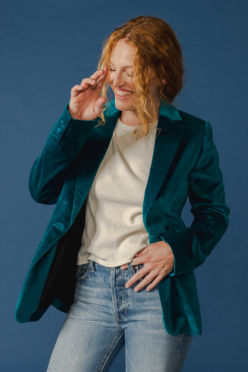 Elevate your style with our Deep Lagoon Velvet Blazer. This tailored slim fit classic adds a touch of luxury to any outfit, making it a timeless wardrobe essential.